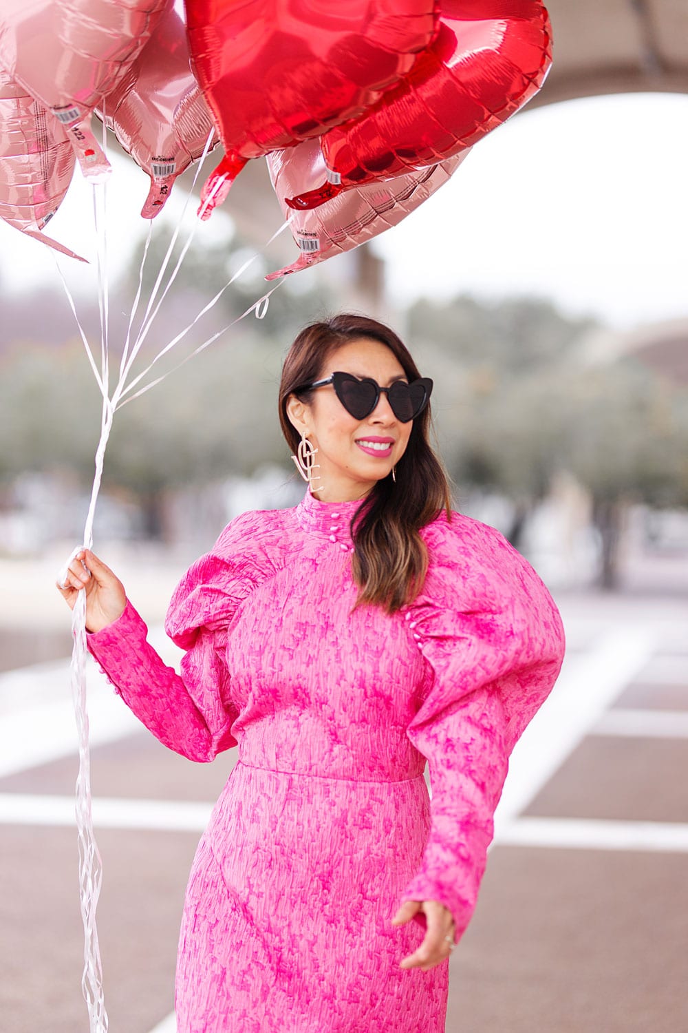 style of sam in rotate pink puff sleeve dress, heart sunglasses, love drop statement earrings