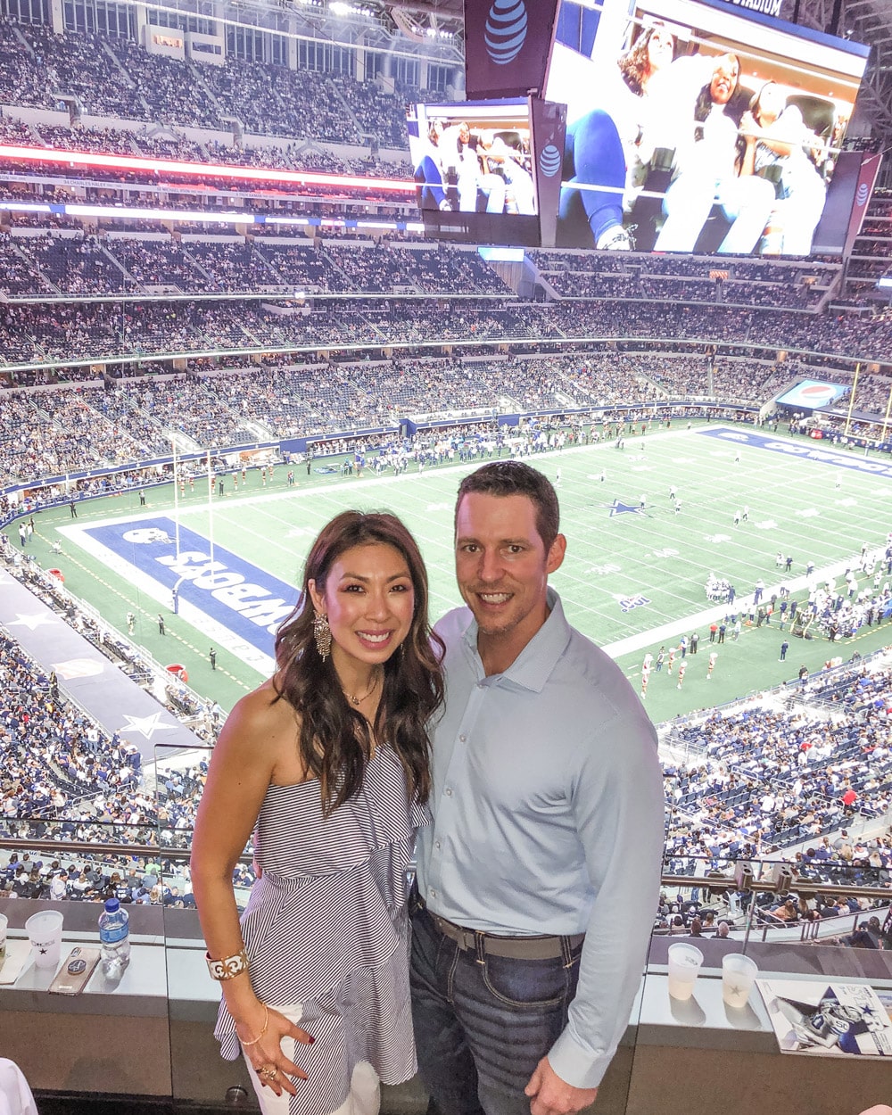 style of sam and husband at dallas cowboys game neiman marcus incircle concierge