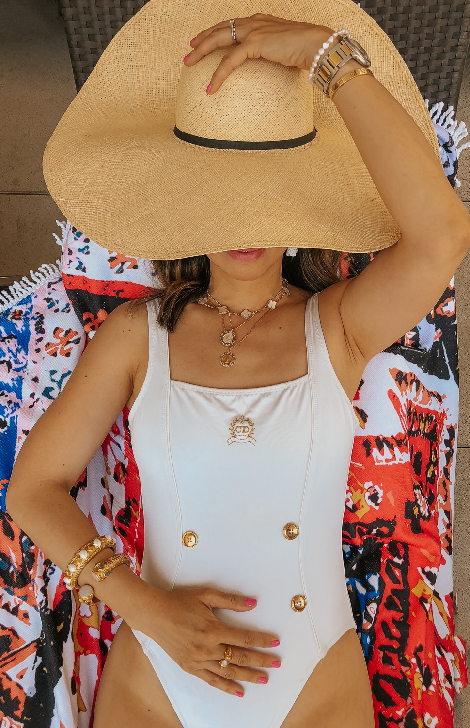 what to wear on a beach vacation | Style of Sam wearing a cream colored swimsuit with gold details