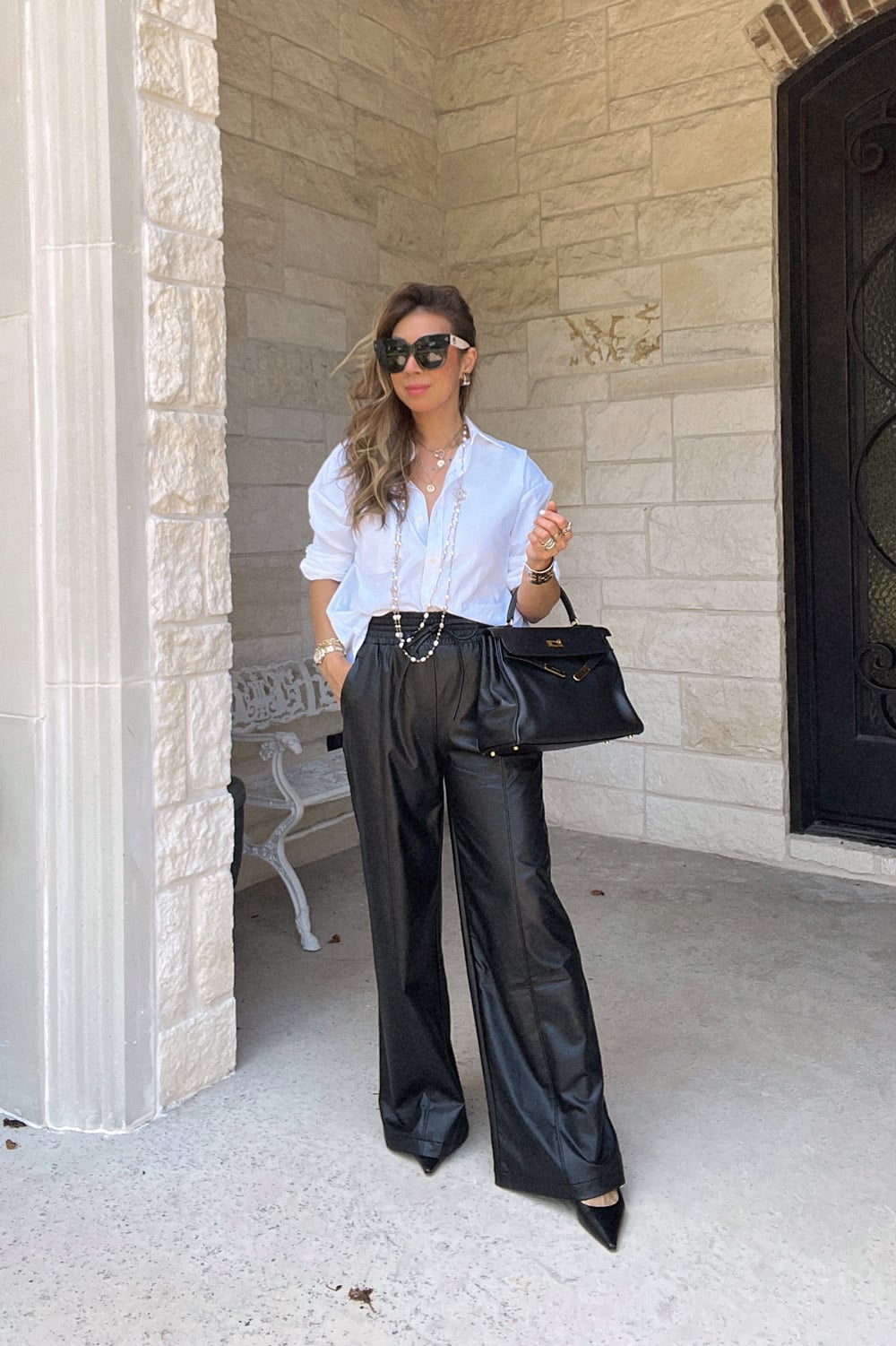 style of sam in djerf ave top, leather wide leg pants, chanel necklace, hermes kelly 32