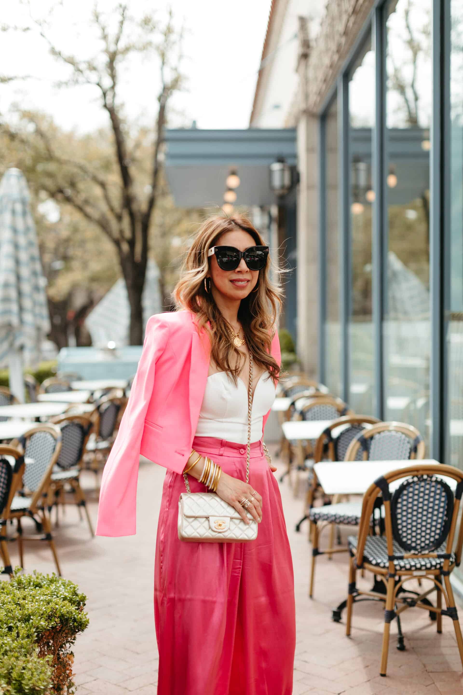 Style of Sam wearing cropped pink blazer and matching pink pants