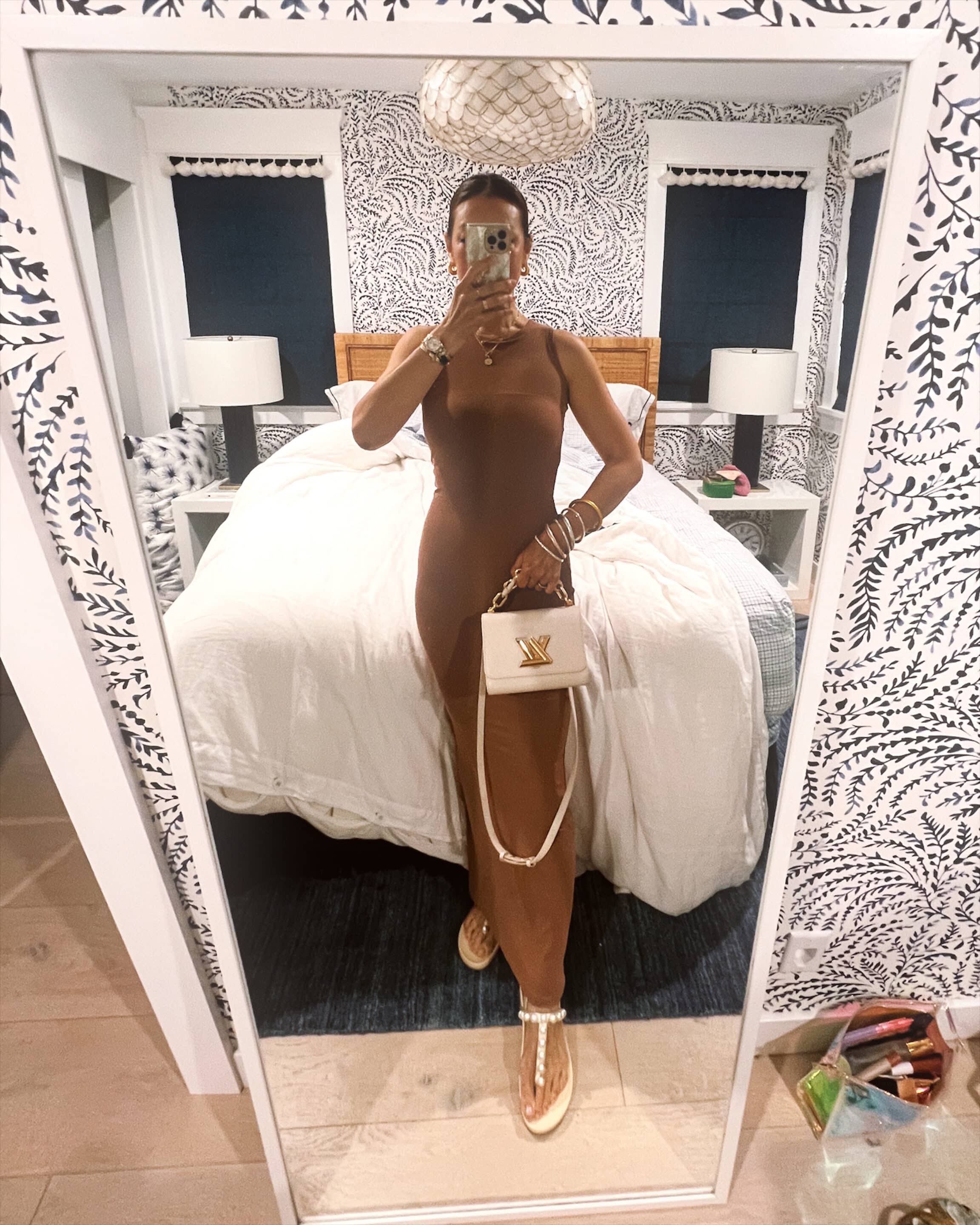 Terrenea Resort wearing Amazon dress and Louis Vuitton bag